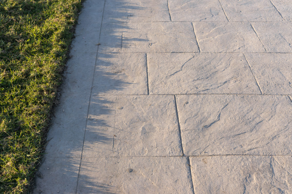 This is an image of a decorative stamped concrete walkway.